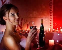 Fine Wine and lady relaxing in a hot tub and life enhancement