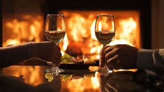 enjoying wine by a fire